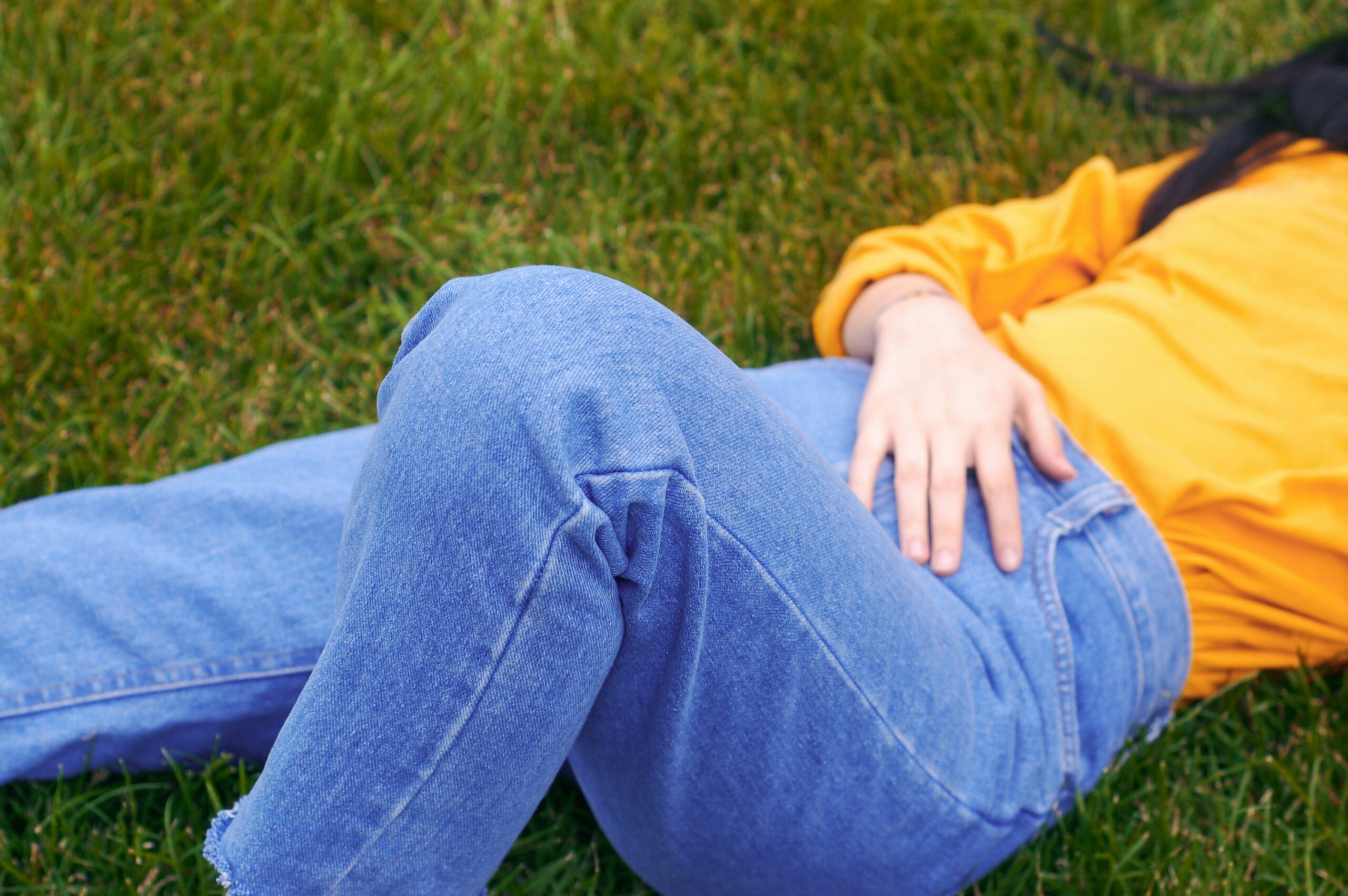 lady holding her pelvis in pain